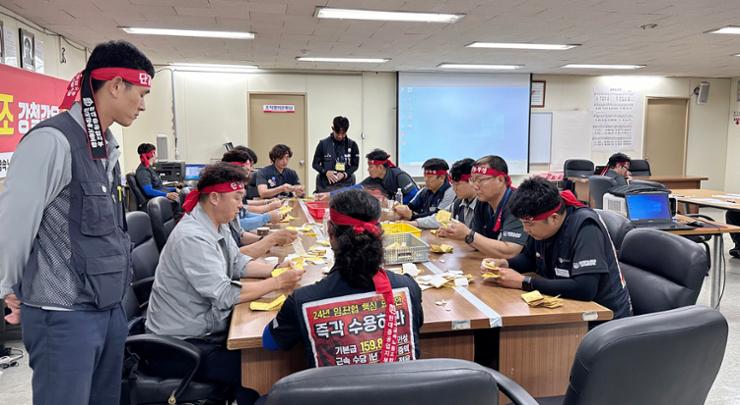 Members of HD Hyundai Heavy Industries' (HHI) union count votes on a strike proposal at the company's headquarters in Ulsan, July 24. Courtesy of HD HHI's union