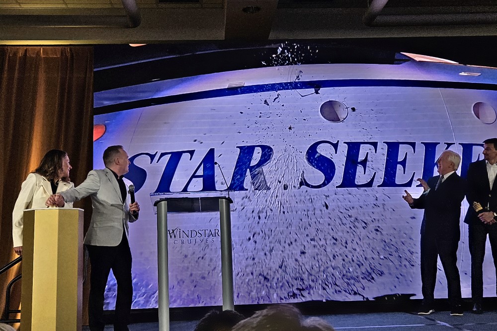 libby anschutz watches as the bottle breaks on the side of the star seeker cruise ship during its naming